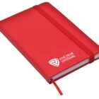 A closed red notebook with a matching elastic band and ribbon bookmark. The cover features the Anchor Systems logo in white. The notebook has rounded edges and a sleek design.
