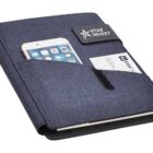 A blue fabric-covered organizer with pockets holds a smartphone and business cards. The cover features a Star Invest logo.