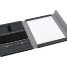 An open black and grey faux leather portfolio with a lined notepad on the right. The left side features compartments for pens, cards, and documents.