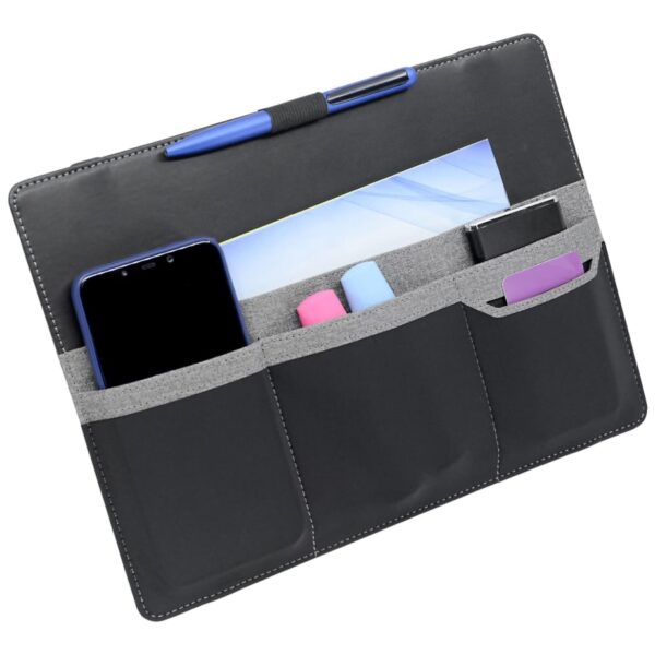 A black organizer pouch with three pockets holds a blue smartphone, light blue and pink cylindrical items, and a small black box. A pen is clipped to the top, and a paper is tucked in the back. The pouch has gray accents.
