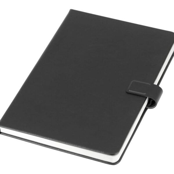 A closed black notebook with a snap closure, lying on a white surface.