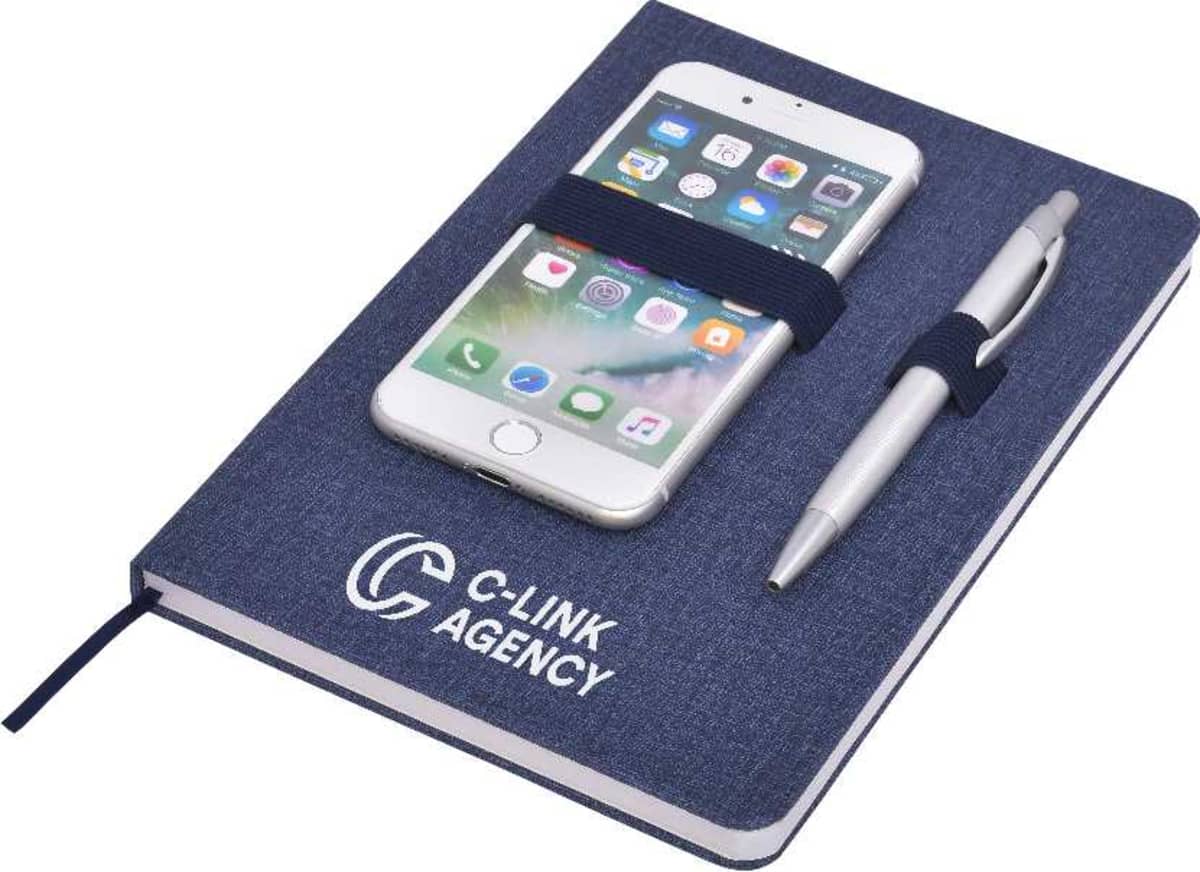 A navy notebook with C-Link Agency logo, holding a smartphone with app icons on the screen and a silver pen secured by elastic straps.