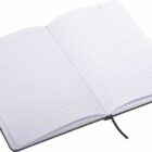 An open, lined notebook with a black cover and a ribbon bookmark in the center. The pages are blank, and theres a date section at the top of each page.