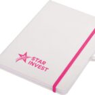 A white notebook with a pink elastic band and a white ribbon bookmark. The cover features a pink star graphic and the text Star Invest.