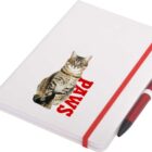 A white notebook with a red elastic band features a printed image of a tabby cat sitting above the word PAWS in bold red letters. A red and black pen is attached to the notebook.