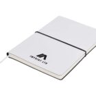 A closed white notebook with a black logo and the text IMPRINT LTD on the cover. It has a black elastic band around it and a white ribbon bookmark peeking out from the bottom.