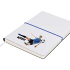 Image of a white notebook with a blue elastic band. The cover features an illustration of a soccer player in a blue jersey, kicking a soccer ball, with the word ACFIRT below the image.