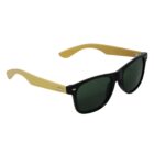 Sunglasses with black frames and green lenses, featuring light wooden arms. The design is modern and elegant with a combination of different materials.