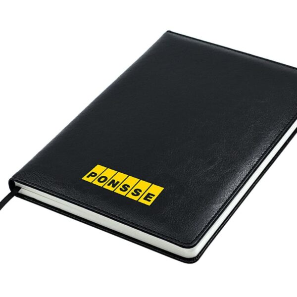 A black notebook with a textured leather cover, featuring the word PONSSE in bold yellow letters on the front. The notebook has a black ribbon bookmark and white pages.