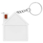 A keychain in the shape of a white house with a silver chain and ring attached. The house features a triangular roof design and a small brown rectangle detail near the top of the roof.