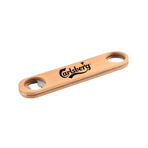 A wooden bottle opener with the Carlsberg logo printed on it. The opener has a circular hole on each end, one with a metal insert for opening bottles.