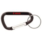 Black carabiner with the Canon logo in red, featuring a silver keyring attached. The carabiner has a silver clasp.