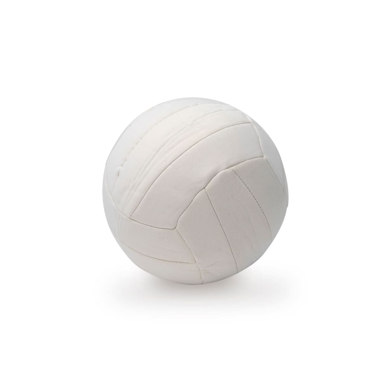 A white volleyball sitting on a plain white background with subtle lighting highlighting its surface and stitched sections.