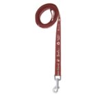 A rolled-up red dog leash with white text and paw print designs. It features a metal clasp at the end for attaching to a collar. The leash displays the words best friend among other text and logos.