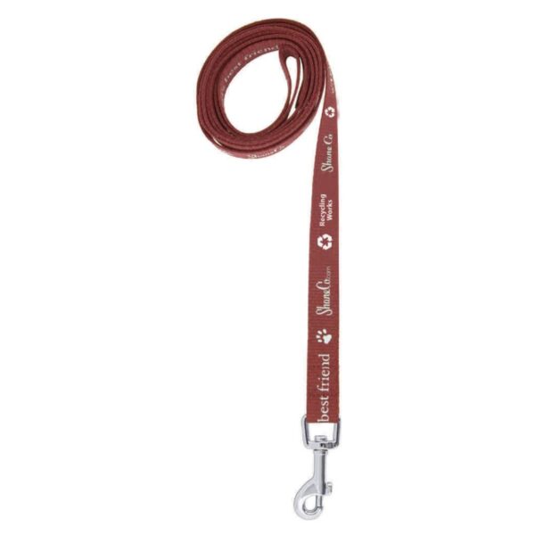 A red dog leash with white text is coiled neatly. It features a metal clasp at one end. The text includes the phrases best friend, Shun Can, and other decorative elements.