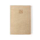 Beige textured notebook with 2021 embossed in gold on the cover, laid flat on a white background.