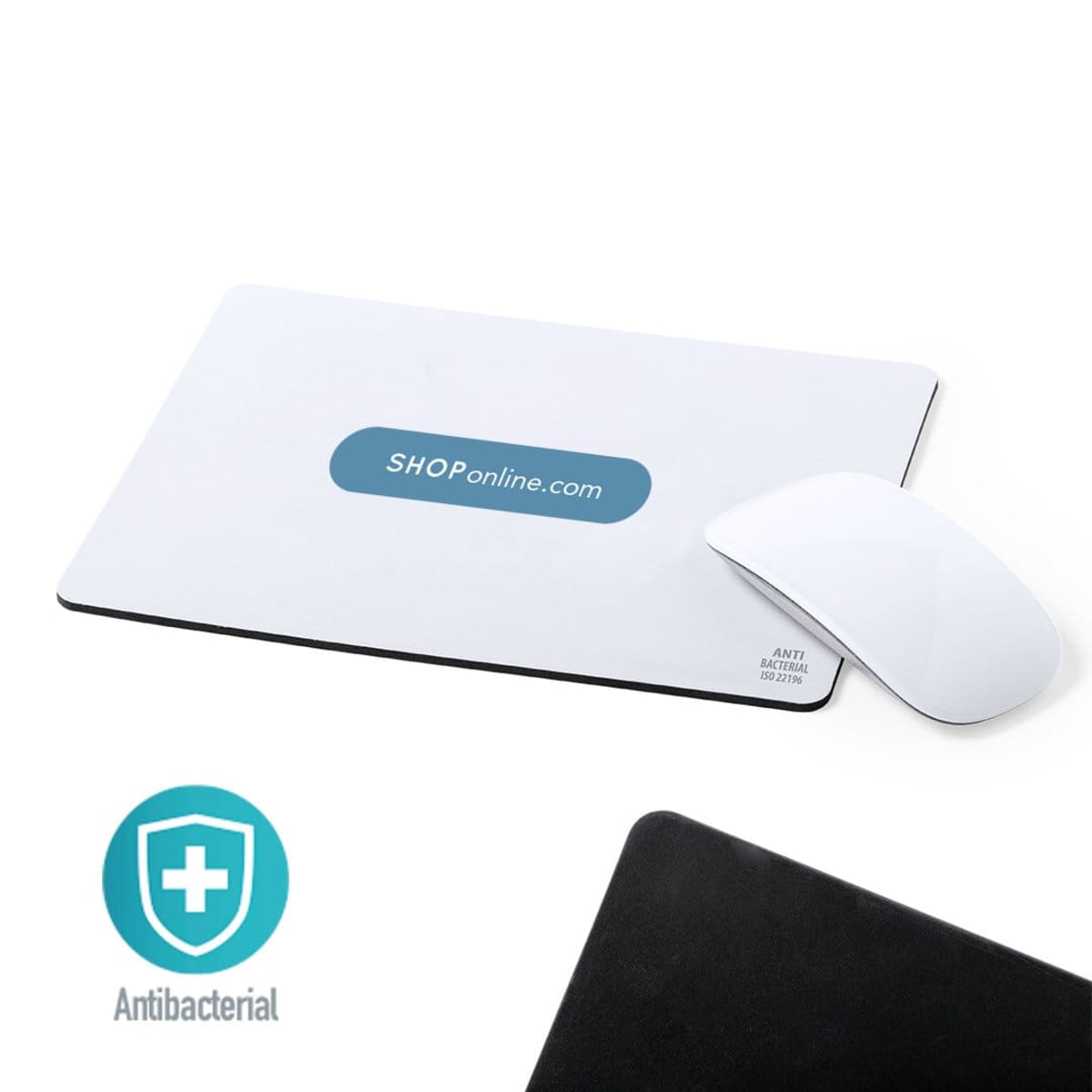 A white mousepad with a blue oval logo reading SHOPonline.com is pictured with a white computer mouse. The bottom right corner has ANTIBACTERIAL ISO 22196 inscribed. Below, a green shield emblem with a cross and the word Antibacterial is shown.