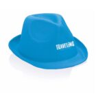 A blue fedora hat with the word TRAVELING printed on the side in white letters. The background is white, highlighting the hat.