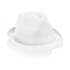 A white fedora hat with a textured fabric is shown against a white background. The hat features a classic crease on the crown and a narrow brim, casting a subtle shadow below.