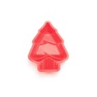 Red plastic mold shaped like a Christmas tree, viewed from above, against a plain white background.