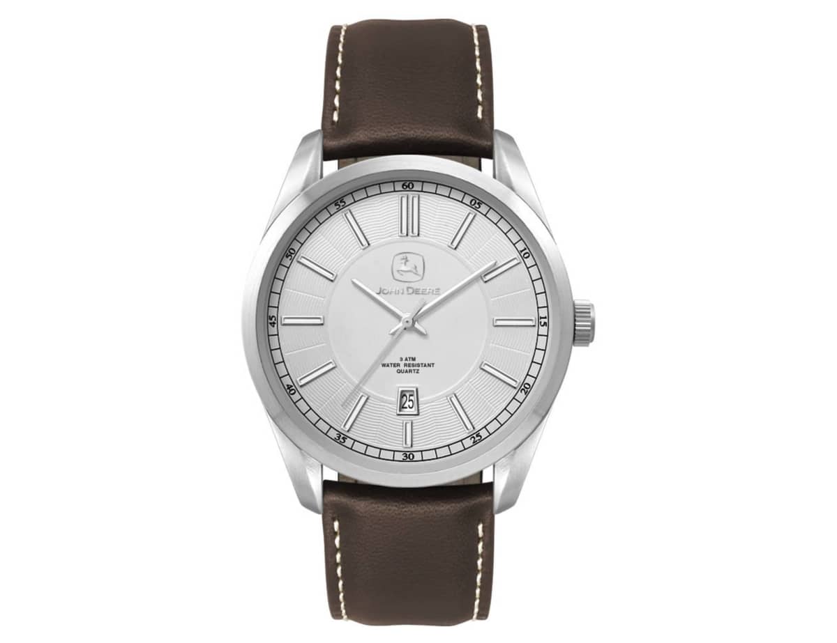 A classic wristwatch with a silver round face, sleek hour markers, and a date window at 6 oclock. It has a brown leather strap with white stitching, a silver bezel, and minimalistic design elements.