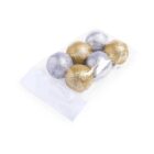 A clear plastic bag contains six glittery Christmas ornaments, with three silver and three gold balls neatly arranged. A white label is attached to the bag.