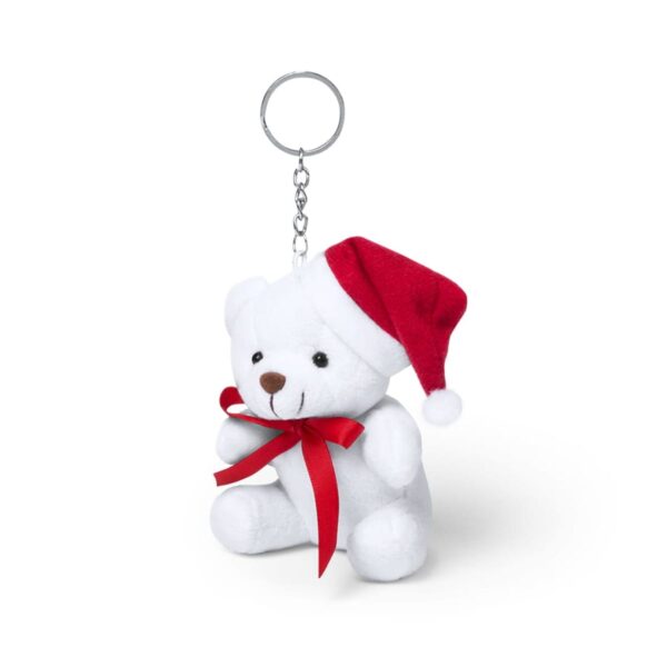 A white teddy bear keychain wearing a red Santa hat and a red ribbon around its neck. The bear has a small brown nose and eyes, and it is sitting upright. The metal chain and ring are attached to the top of its head.