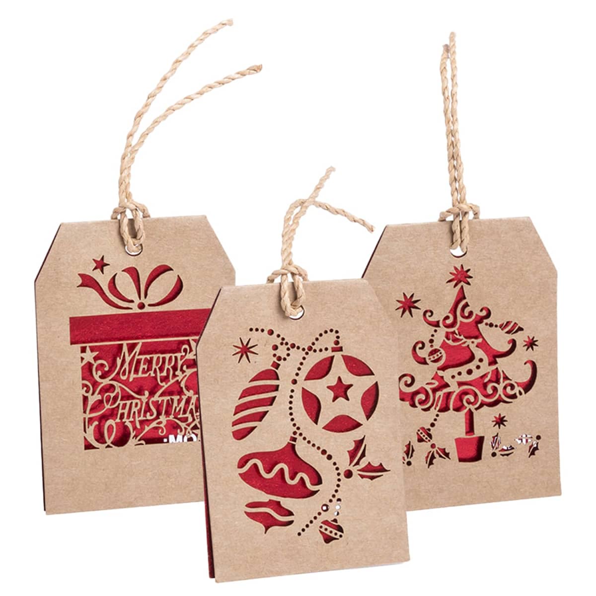 Three rustic gift tags with festive designs cut out. One has Merry Christmas with a present, another shows hanging baubles, and the third features a Christmas tree. Each tag has a twisted string attached.