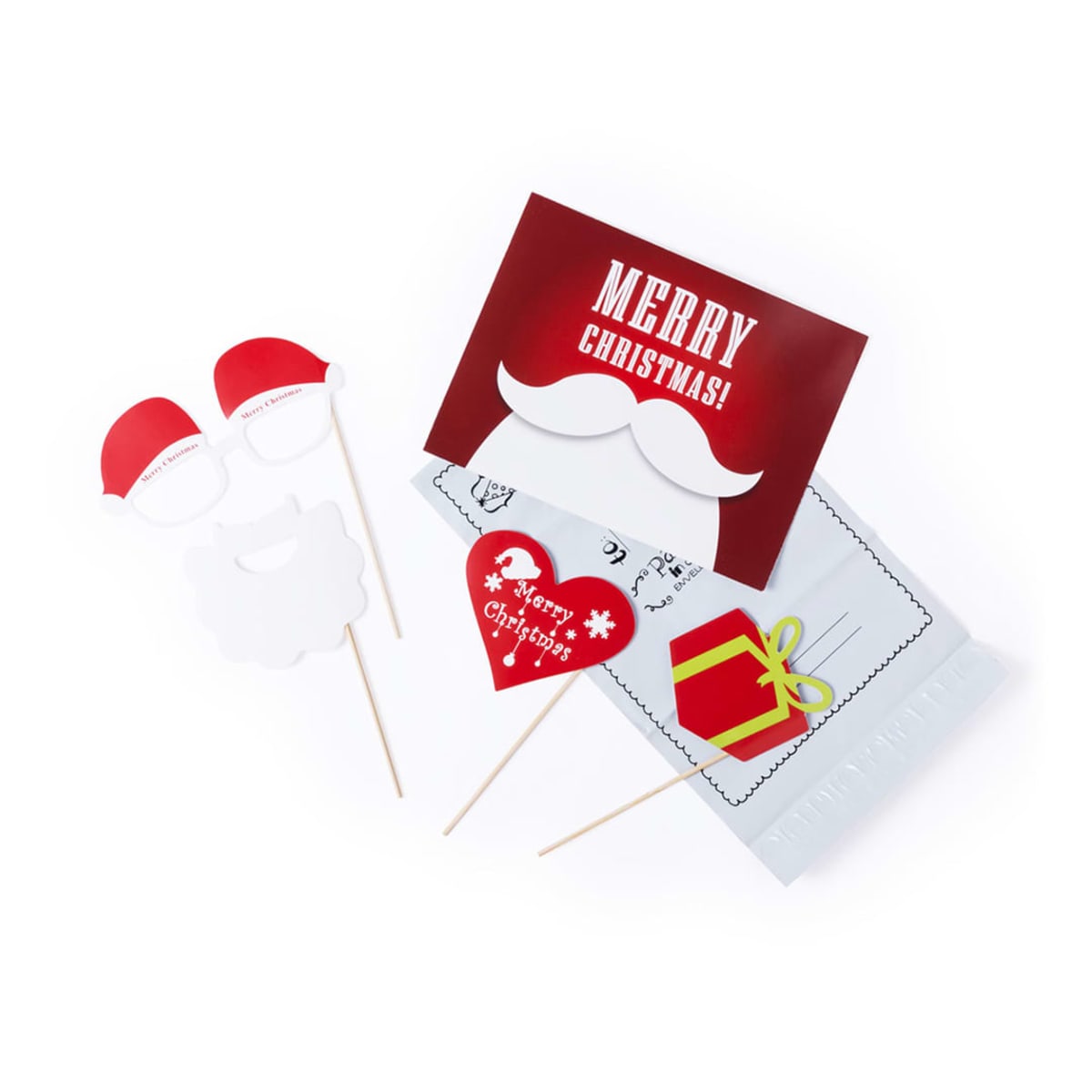 Christmas-themed photo booth props including Santa hats, glasses, beard, and a mustache on sticks, with a red and white Merry Christmas! sign, heart with gift tag, and decorative elements laid out on a white background.