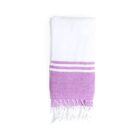 A folded white towel featuring a wide purple stripe near one end. The purple section has two thin white stripes running across it. Fringed tassels in white hang from the striped end.