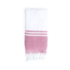 A folded towel with a white upper section and a red lower section featuring two white stripes. The bottom edge of the red section has white tassels.