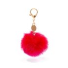 A bright pink furry pom-pom keychain with a small gold clasp and a gold tag attached at the top. The background is plain white.