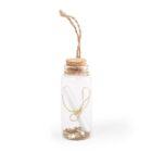 A small glass bottle with a cork stopper and twine loop at the top. Inside, there is a rolled paper tied with a gold thread, surrounded by metallic star-shaped confetti.