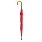 A closed red umbrella with a wooden curved handle stands upright against a plain white background.