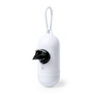 A white cylindrical holder with a carabiner clip dispenses black plastic bags. The holder has an opening from which a partially pulled-out bag is visible, designed for easy access and portability.