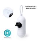 White antibacterial plastic dispenser with a clip, containing 15 biodegradable bags. A close-up shows the material texture. A blue antibacterial icon is displayed nearby.