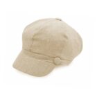 A beige newsboy cap with a soft, textured fabric and a short, curved brim. The cap features a button detail on the side, giving it a classic, vintage look against a plain white background.