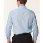 A man in a light blue long-sleeve shirt and black trousers is shown from the back. The shirt features subtle vertical stripes. He has short brown hair and is standing against a plain white background.