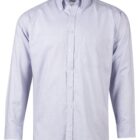 A light blue, long-sleeved button-up shirt with a collar and a chest pocket on the left side. The fabric has a subtle texture, and the shirt is displayed against a plain white background.