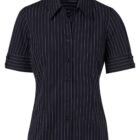 A black short-sleeved shirt with white vertical pinstripes and a button-up front. The shirt features a pointed collar and a chest pocket. The sleeves have button detailing near the cuffs.