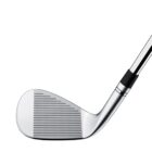 Close-up of a silver golf club iron with a grooved face and black accents on the hosel and shaft. The club is angled to the right, showing a modern, sleek design against a white background.