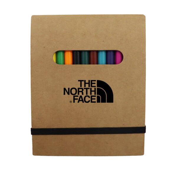 A brown cardboard case displaying the North Face logo holds a set of colored pencils visible through an oval window. A black elastic band secures the case.