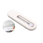 White oval soap holder with a drainage slot. Inset image shows the soap holder in use, held under running water, demonstrating its drainage feature.
