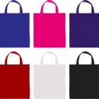 An image of six square tote bags arranged in two rows. Top row: blue, bright pink, and dark purple bags. Bottom row: red, white, and black bags. Each bag has two handles and is shown against a white background.