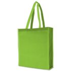A bright green, reusable tote bag with two handles is standing upright against a plain white background. The bag has a simple, unadorned design, emphasizing its eco-friendly nature.