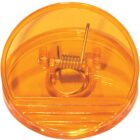 A round orange plastic cap with a metal coil inside. The cap is transparent and has a flat bottom with a circular top. The metal coil is centrally placed and clearly visible through the plastic.