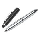 A silver ballpoint pen with its black cap removed and placed beside it. The cap has a metal clip and a stylus tip for touchscreen use.
