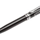 A sleek black ballpoint pen with a silver clip and accents. The pen has Harvey Industrial printed on the barrel in white text.