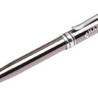 A silver and black ballpoint pen with a clip, featuring the words HARVEY INDUSTRIAL engraved on the side.