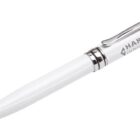 A white ballpoint pen with silver accents and a clip. The pen features the text HARVEY INDUSTRIAL in gray on its body.